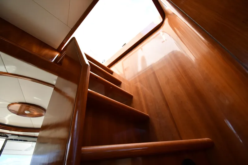 Surfin The Net Yacht Photos Pics Wooden staircase inside 2001 Ferretti Yachts 72, leading to upper deck.