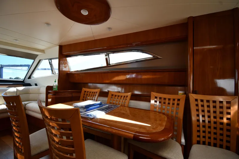 Surfin The Net Yacht Photos Pics Luxurious interior of 2001 Ferretti Yachts 72 with elegant wood finishes and seating area.