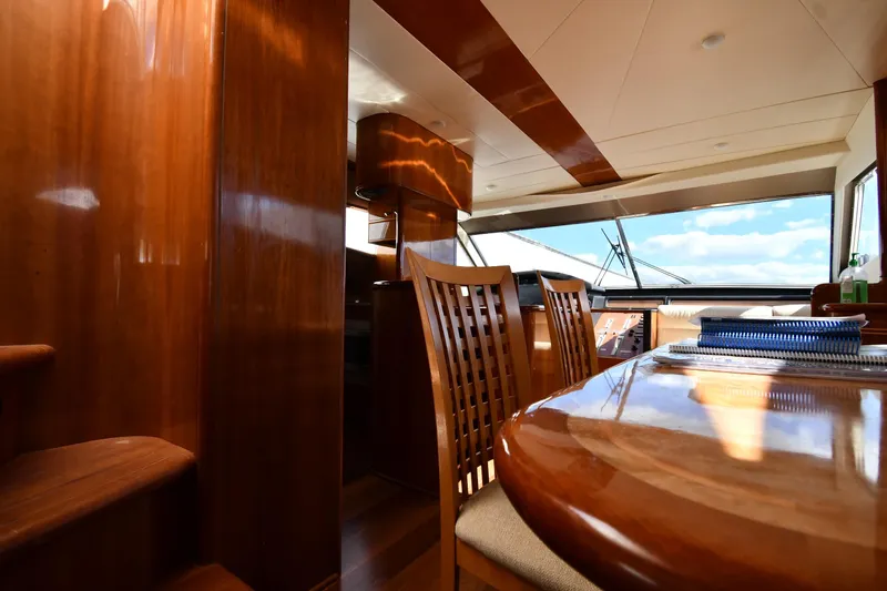 Surfin The Net Yacht Photos Pics Luxurious interior of 2001 Ferretti Yachts 72 with polished wood and panoramic windows.