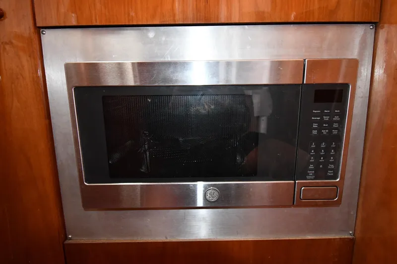 Surfin The Net Yacht Photos Pics Built-in microwave in 2001 Ferretti Yachts 72 kitchen area.