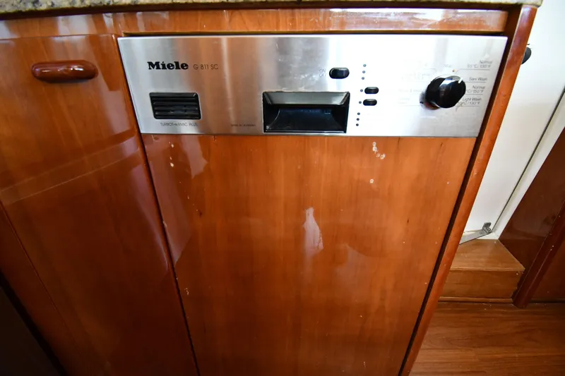 Surfin The Net Yacht Photos Pics Miele dishwasher in 2001 Ferretti Yachts 72, wooden cabinetry, stainless steel panel.