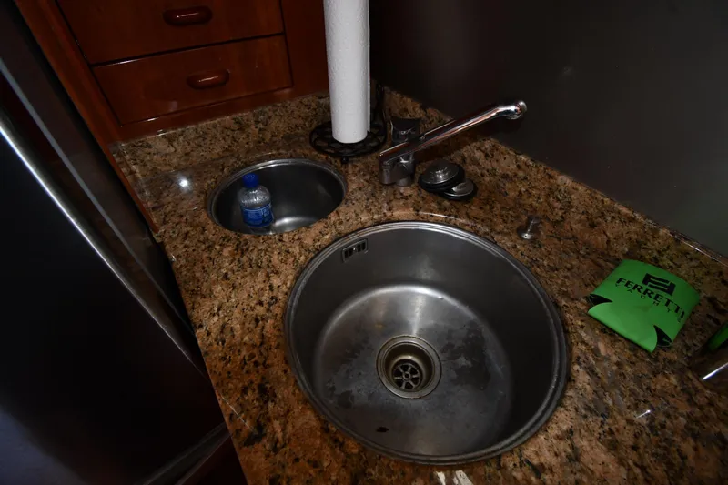 Surfin The Net Yacht Photos Pics Kitchen sink area on a 2001 Ferretti Yachts 72 with granite countertop.
