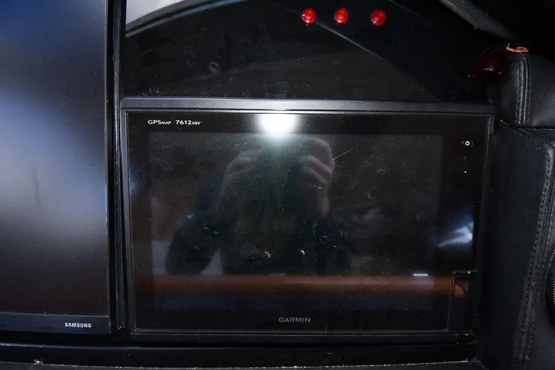 Surfin The Net Yacht Photos Pics Garmin GPSMAP 7612xsv display on 2001 Ferretti Yachts 72 dashboard.
