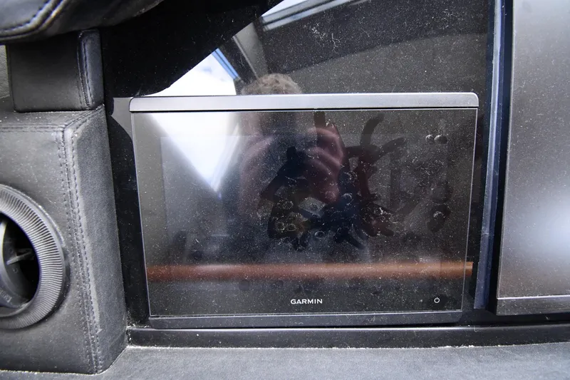 Surfin The Net Yacht Photos Pics Garmin display on 2001 Ferretti Yachts 72 dashboard, featuring sleek design and modern technology.