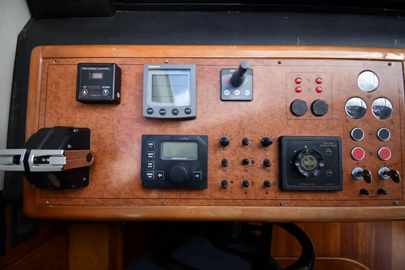 Surfin The Net Yacht Photos Pics Control panel of a 2001 Ferretti Yachts 72, featuring navigation and anchoring systems.