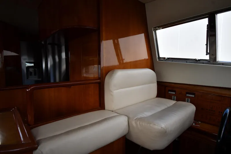 Surfin The Net Yacht Photos Pics Luxurious interior of 2001 Ferretti Yachts 72 with plush seating and wooden accents.