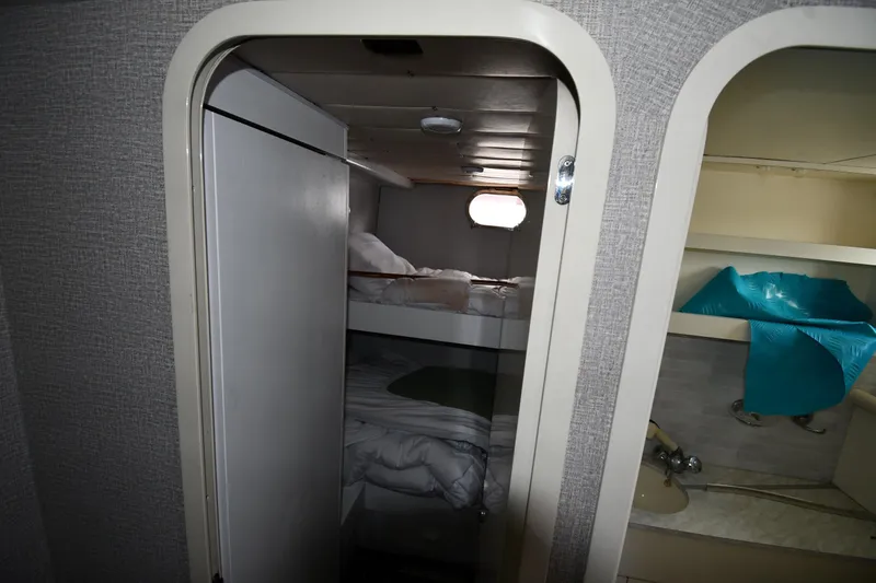 Surfin The Net Yacht Photos Pics Interior cabin of 2001 Ferretti Yachts 72, featuring bunk beds and compact design.