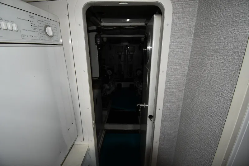 Surfin The Net Yacht Photos Pics Engine room entrance of 2001 Ferretti Yachts 72, featuring a visible control panel.