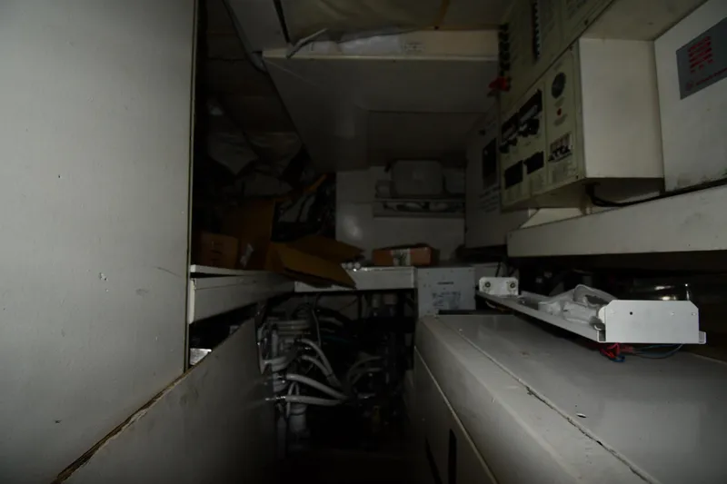 Surfin The Net Yacht Photos Pics Engine room of a 2001 Ferretti Yachts 72, showcasing control panels and wiring.