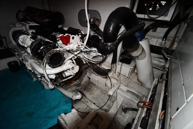 Surfin The Net Yacht Photos Pics Engine room of a 2001 Ferretti Yachts 72, showcasing mechanical components.