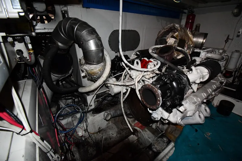 Surfin The Net Yacht Photos Pics Engine room of a 2001 Ferretti Yachts 72, showcasing mechanical components and wiring.