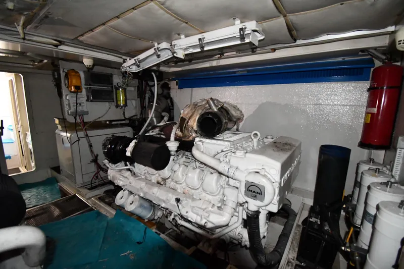 Surfin The Net Yacht Photos Pics Engine room of a 2001 Ferretti Yachts 72, featuring a MAN engine.