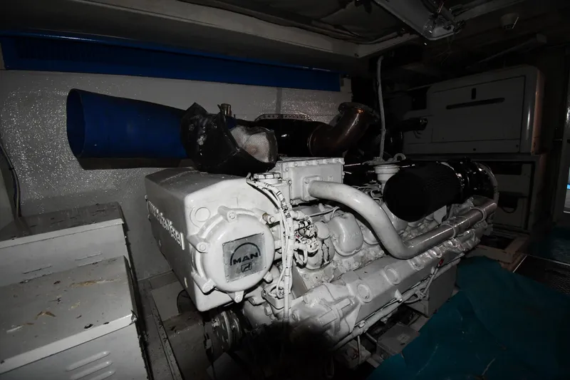 Surfin The Net Yacht Photos Pics Engine room of a 2001 Ferretti Yachts 72, featuring a MAN engine.