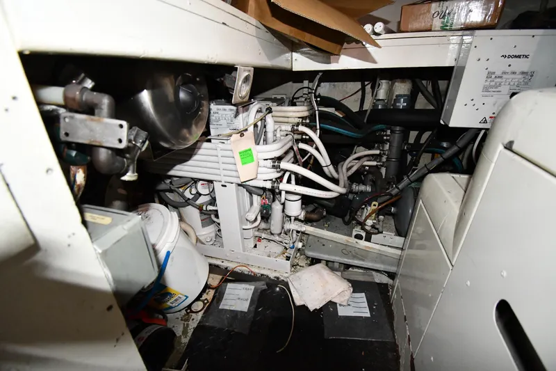 Surfin The Net Yacht Photos Pics Engine room of a 2001 Ferretti Yachts 72, showcasing mechanical components and wiring.