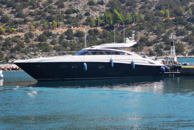 Gio Mare Yacht Photos Pics Luxury 2011 Princess V62 yacht docked in scenic marina setting.