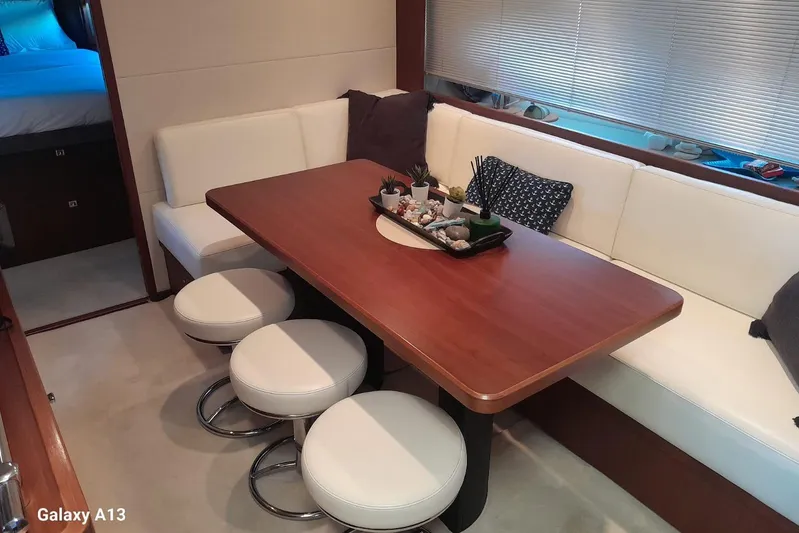 Gio Mare Yacht Photos Pics Luxurious 2011 Princess V62 yacht interior with elegant dining area and modern decor.