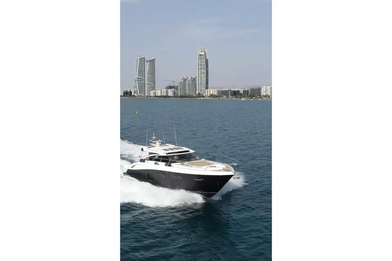 Gio Mare Yacht Photos Pics Luxury Princess V62 yacht cruising near city skyline, 2011 model.