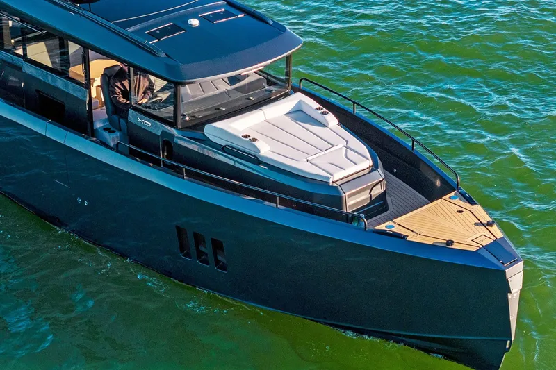  Yacht Photos Pics 2025 XO Boats EXPLR 44 yacht cruising on clear blue water.