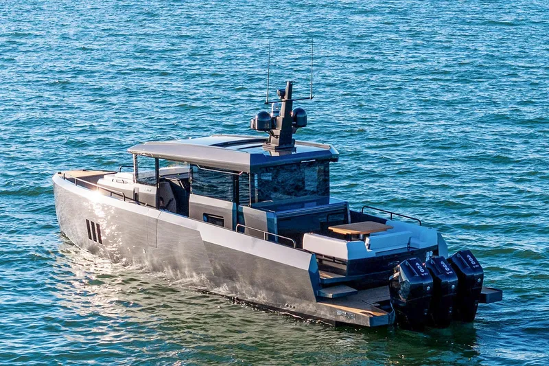  Yacht Photos Pics 2025 XO Boats EXPLR 44 cruising on open water, showcasing sleek design and powerful engines.