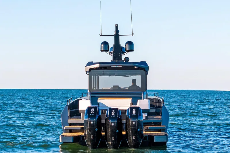  Yacht Photos Pics 2025 XO Boats EXPLR 44 on open water, rear view with triple engines.