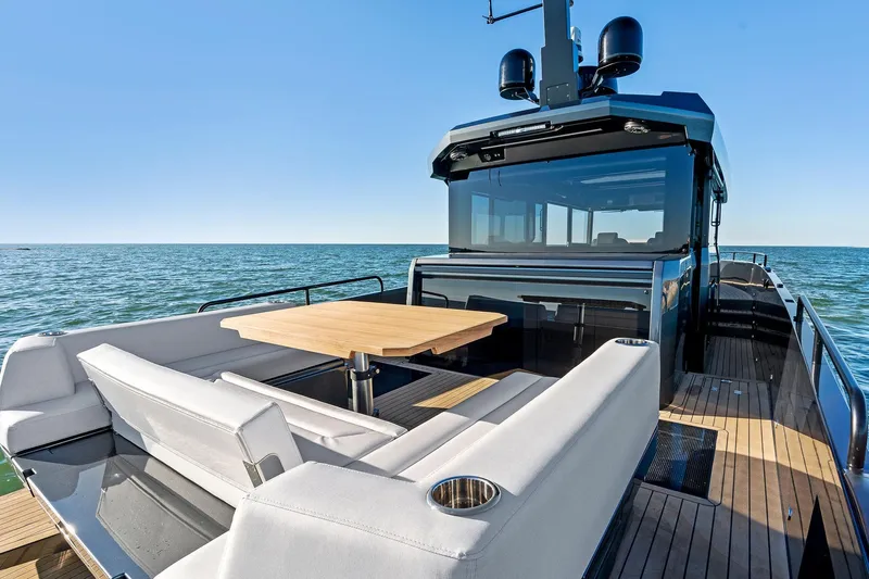  Yacht Photos Pics 2025 XO Boats EXPLR 44 yacht with sleek deck and seating, cruising on open water.