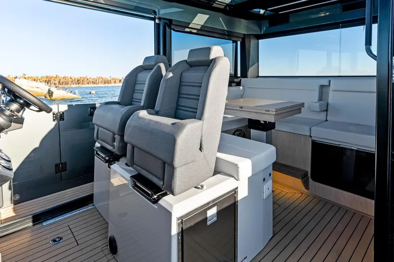  Yacht Photos Pics 2025 XO Boats EXPLR 44 interior with modern seating and scenic water view.