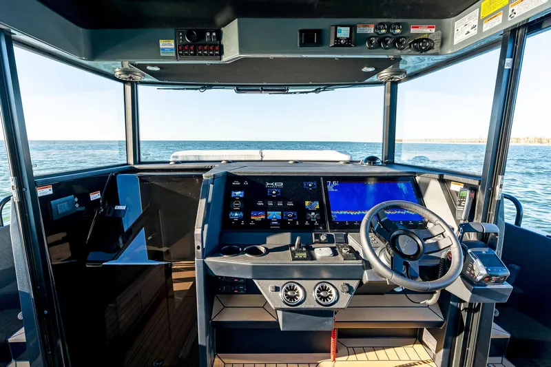  Yacht Photos Pics 2025 XO Boats EXPLR 44 cockpit with advanced navigation systems and ocean view.