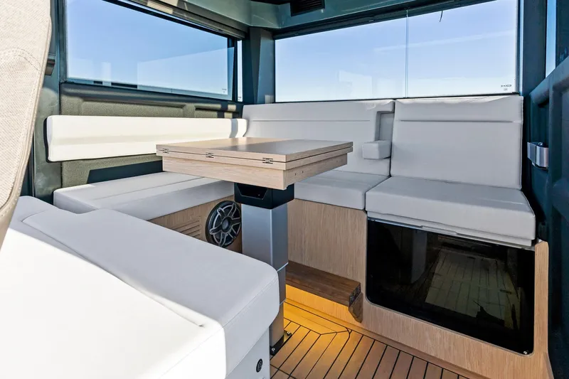  Yacht Photos Pics Modern interior of 2025 XO Boats EXPLR 44 with sleek seating and wooden accents.
