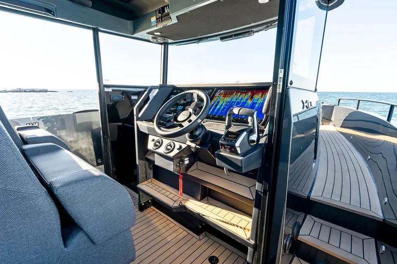 Yacht Photos Pics Interior view of 2025 XO Boats EXPLR 44 cockpit with advanced navigation system.