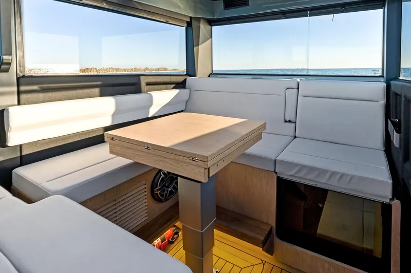  Yacht Photos Pics Modern interior of 2025 XO Boats EXPLR 44 with sleek seating and ocean view.