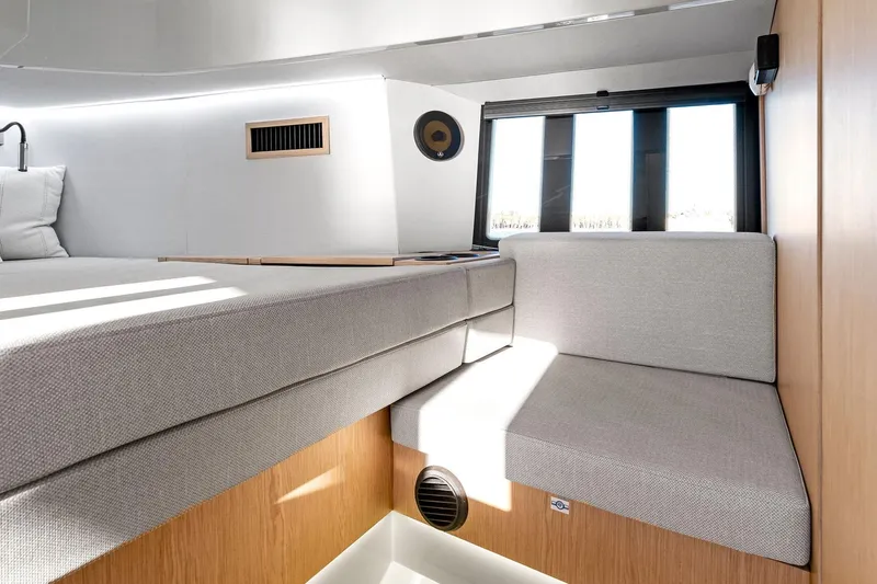  Yacht Photos Pics 2025 XO Boats EXPLR 44 interior cabin with modern seating and natural light.