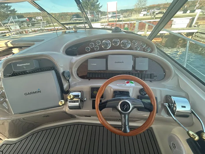  Yacht Photos Pics 2001 Sea Ray 410 Express Cruiser helm with Garmin and Raymarine navigation systems.