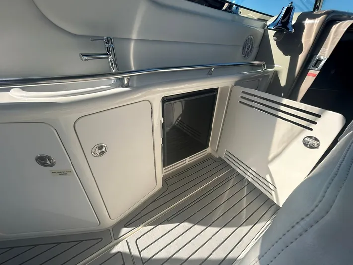  Yacht Photos Pics 2001 Sea Ray 410 Express Cruiser interior with open storage compartment and sleek design.