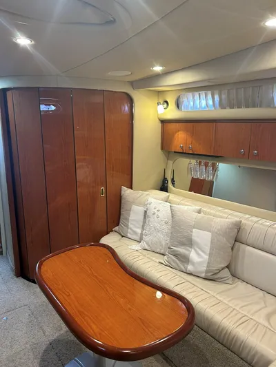  Yacht Photos Pics Interior of 2001 Sea Ray 410 Express Cruiser with wood accents and plush seating.
