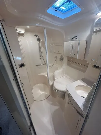  Yacht Photos Pics 2001 Sea Ray 410 Express Cruiser bathroom with shower, sink, and toilet.