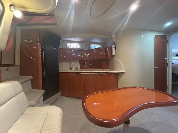  Yacht Photos Pics Interior of 2001 Sea Ray 410 Express Cruiser with modern kitchen and seating area.