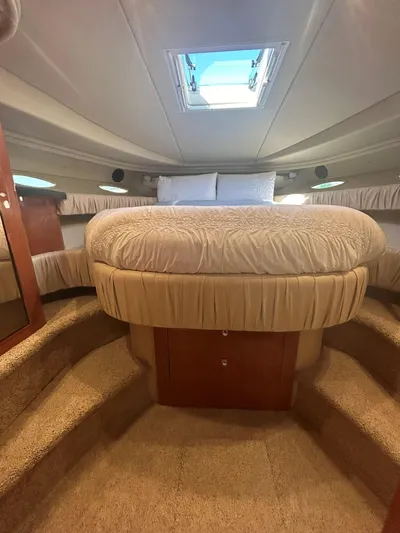  Yacht Photos Pics Luxurious cabin interior of 2001 Sea Ray 410 Express Cruiser with plush bedding and skylight.