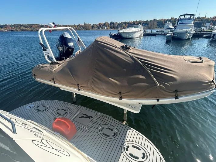  Yacht Photos Pics Covered boat docked on water, near a 2001 Sea Ray 410 Express Cruiser.