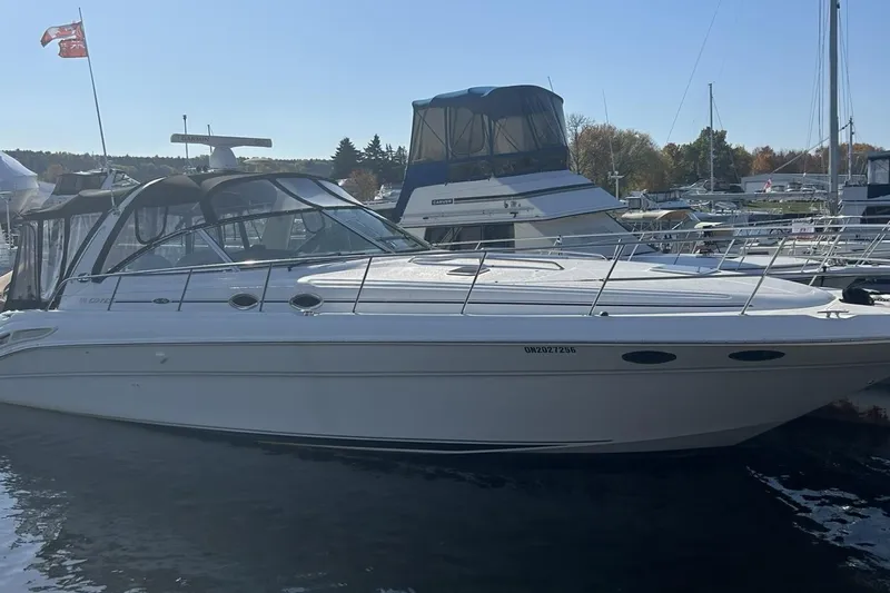  Yacht Photos Pics 2001 Sea Ray 410 Express Cruiser docked at marina, side view.