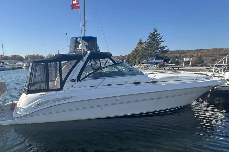  Yacht Photos Pics 2001 Sea Ray 410 Express Cruiser docked at marina under clear blue sky.