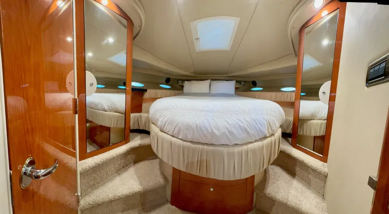  Yacht Photos Pics Luxurious cabin interior of 2001 Sea Ray 410 Express Cruiser with mirrored closets.