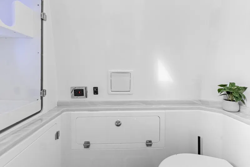 Onyx Yacht Photos Pics Modern bathroom interior of 2023 HCB 39 Speciale boat with sleek design and potted plant.