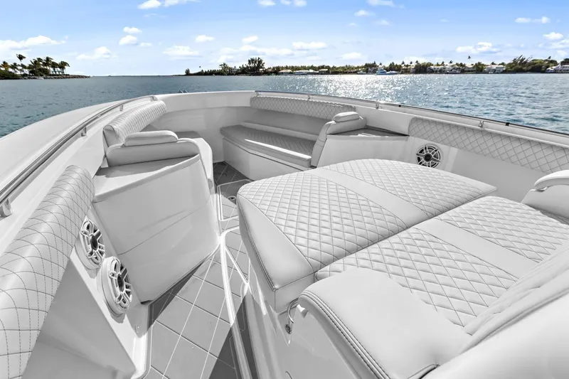 Onyx Yacht Photos Pics Luxurious interior of 2023 HCB 39 Speciale boat with quilted seating, on a sunny day.