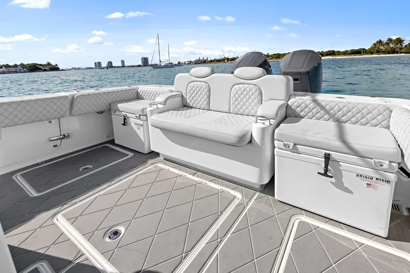 Onyx Yacht Photos Pics Luxurious 2023 HCB 39 Speciale boat interior with plush seating and ocean view.