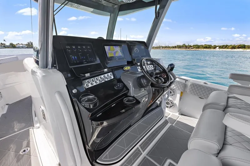 Onyx Yacht Photos Pics 2023 HCB 39 Speciale boat cockpit with advanced navigation system and luxurious seating.