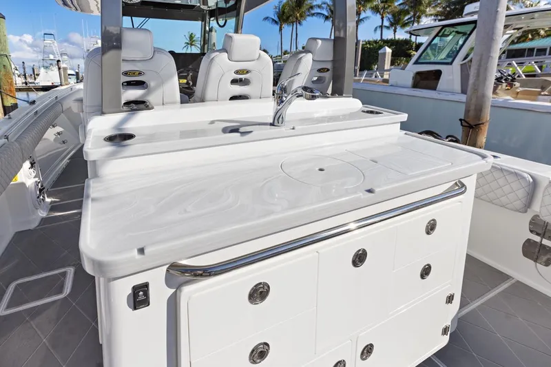 Onyx Yacht Photos Pics 2023 HCB 39 Speciale boat interior with sleek white cabinetry and seating.