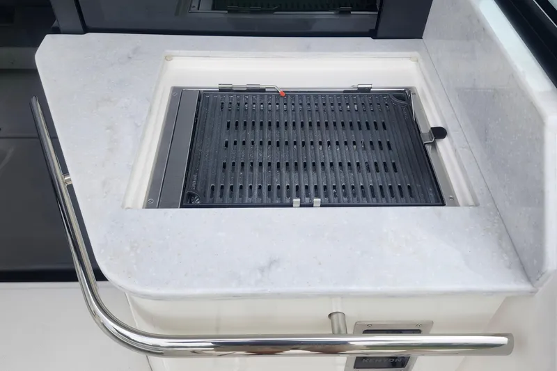  Yacht Photos Pics Built-in grill on 2026 Regal 36 XO yacht with sleek countertop design.