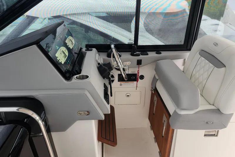  Yacht Photos Pics 2026 Regal 36 XO boat cockpit with modern controls and luxurious seating.