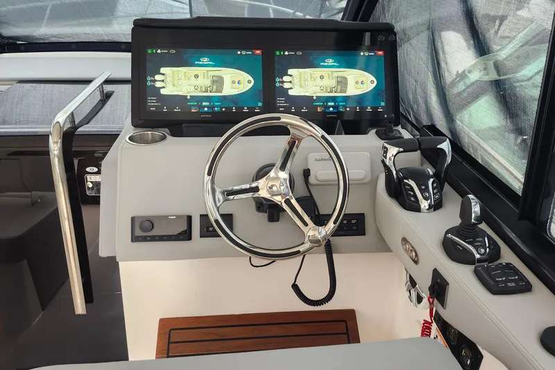  Yacht Photos Pics Helm of 2026 Regal 36 XO boat with dual displays and modern controls.