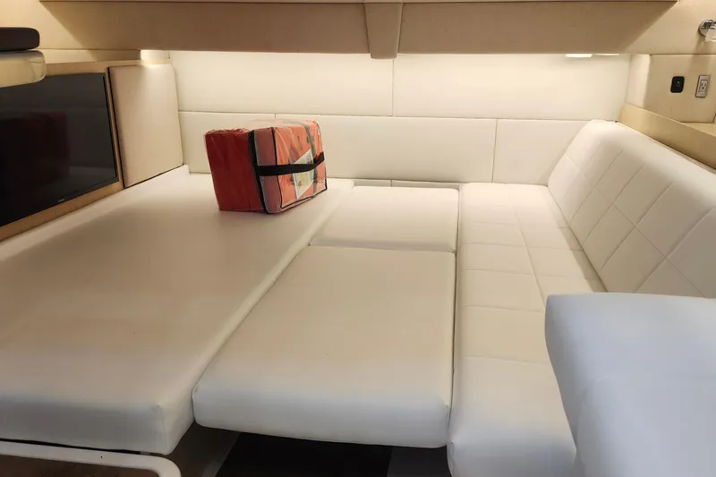  Yacht Photos Pics Luxurious interior of 2026 Regal 36 XO yacht with white seating and a life jacket.